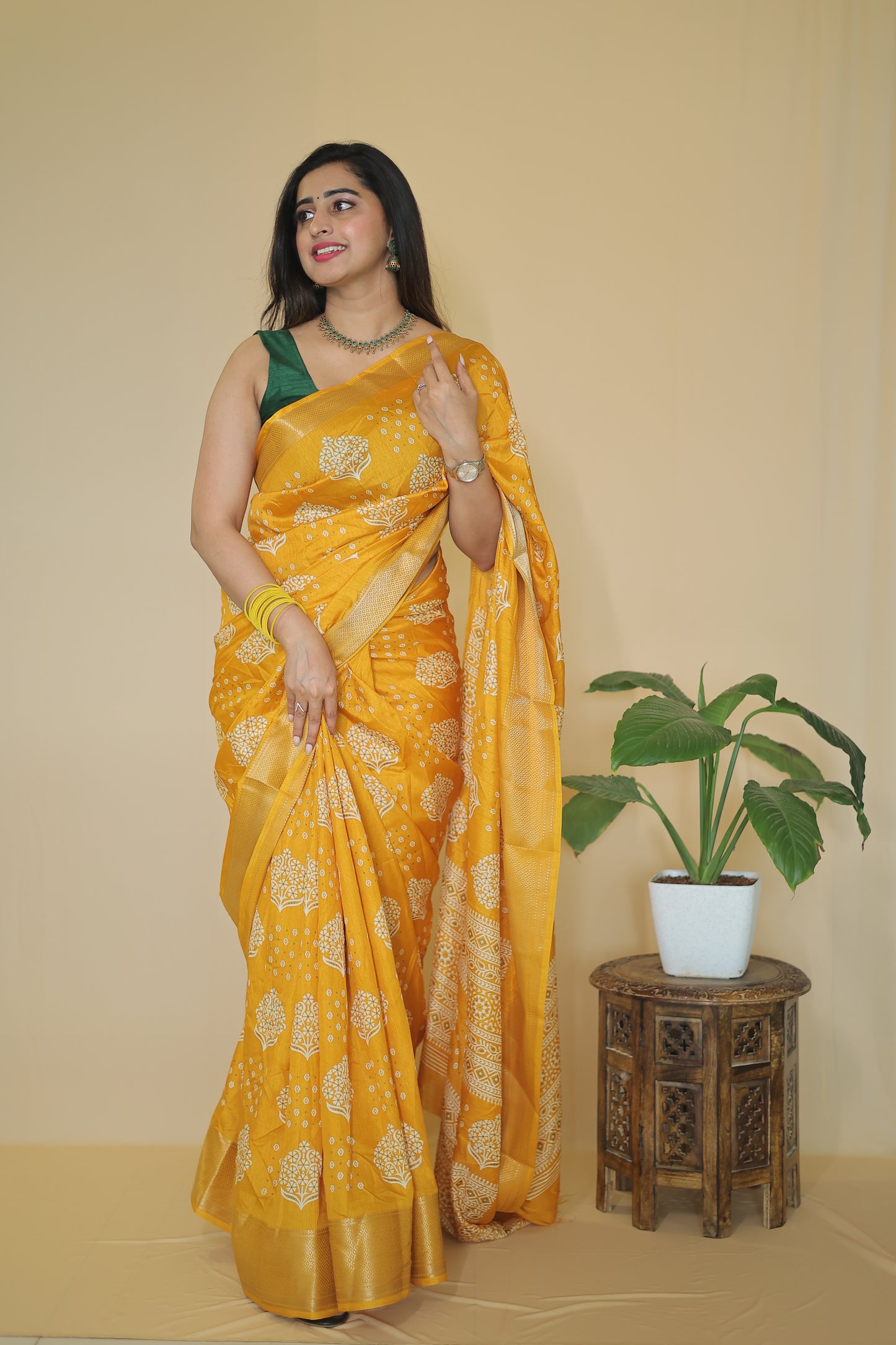 Yellow color Banarasi Silk Saree with Intricate White Floral Motifs