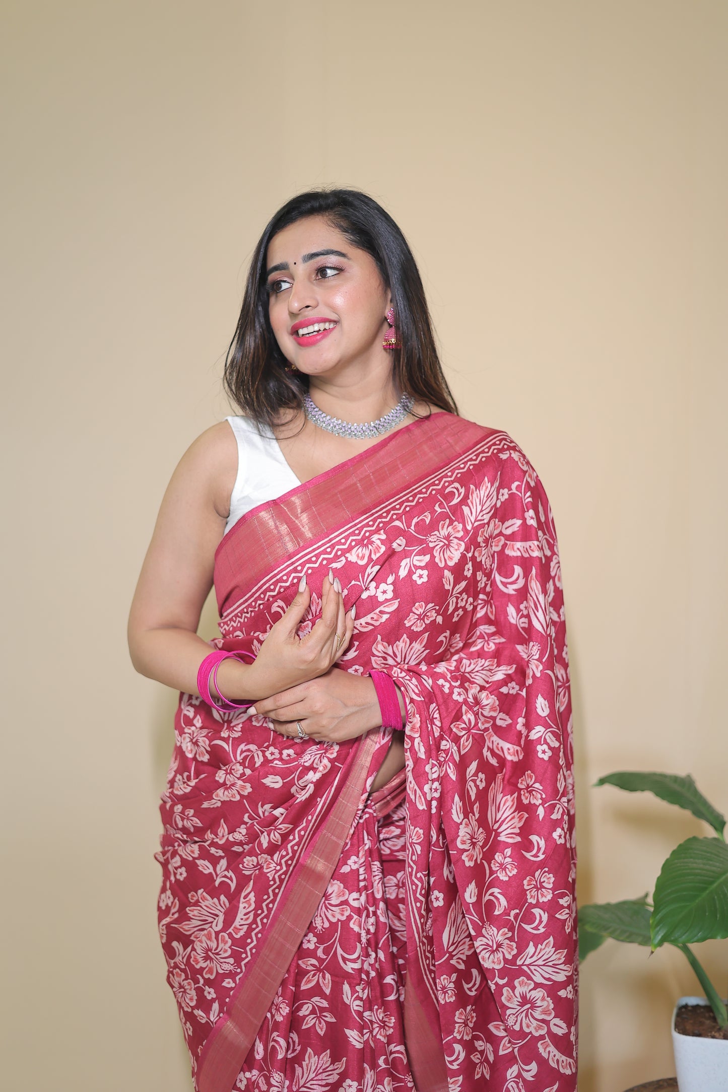 Rani Pink Banarasi Silk Saree with White Floral Motifs and Traditional Border