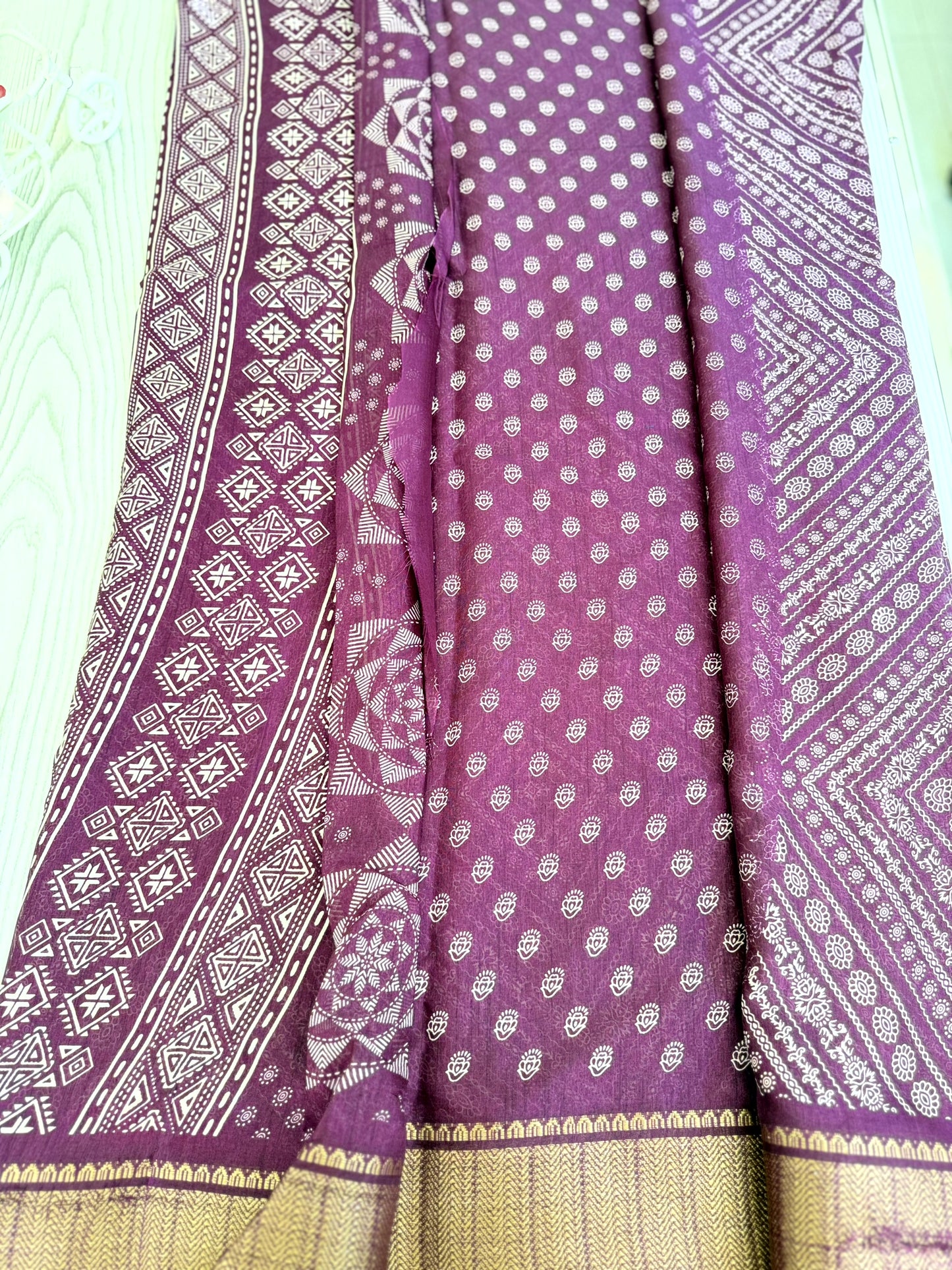 Graceful Purple Soft Silk Saree with Golden Border and Traditional Patterns
