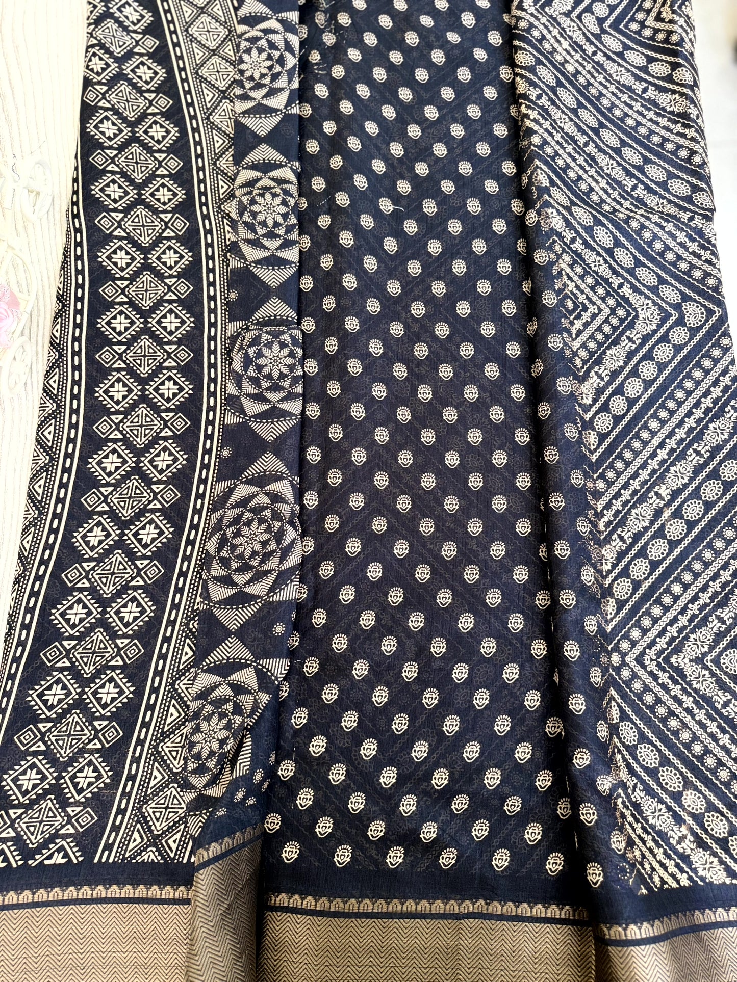 Graceful Black Soft Silk Saree with Golden Border and Traditional Patterns